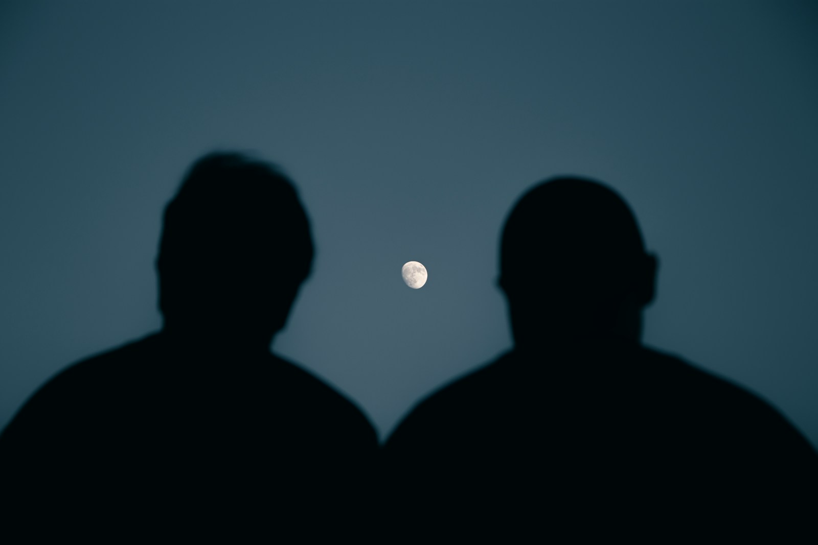 a couple of men standing next to each other